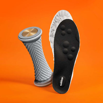 A textured grey foot roller and a black insole floating on an orange backdrop.