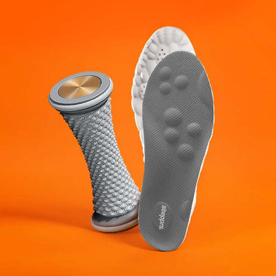 A textured grey foot roller and an insole floating against an orange backdrop.