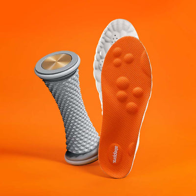 A textured grey foot roller and an orange insole floating on an orange backdrop.