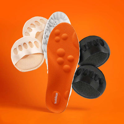 An orange insole and fabric toe cushions floating against an orange backdrop.
